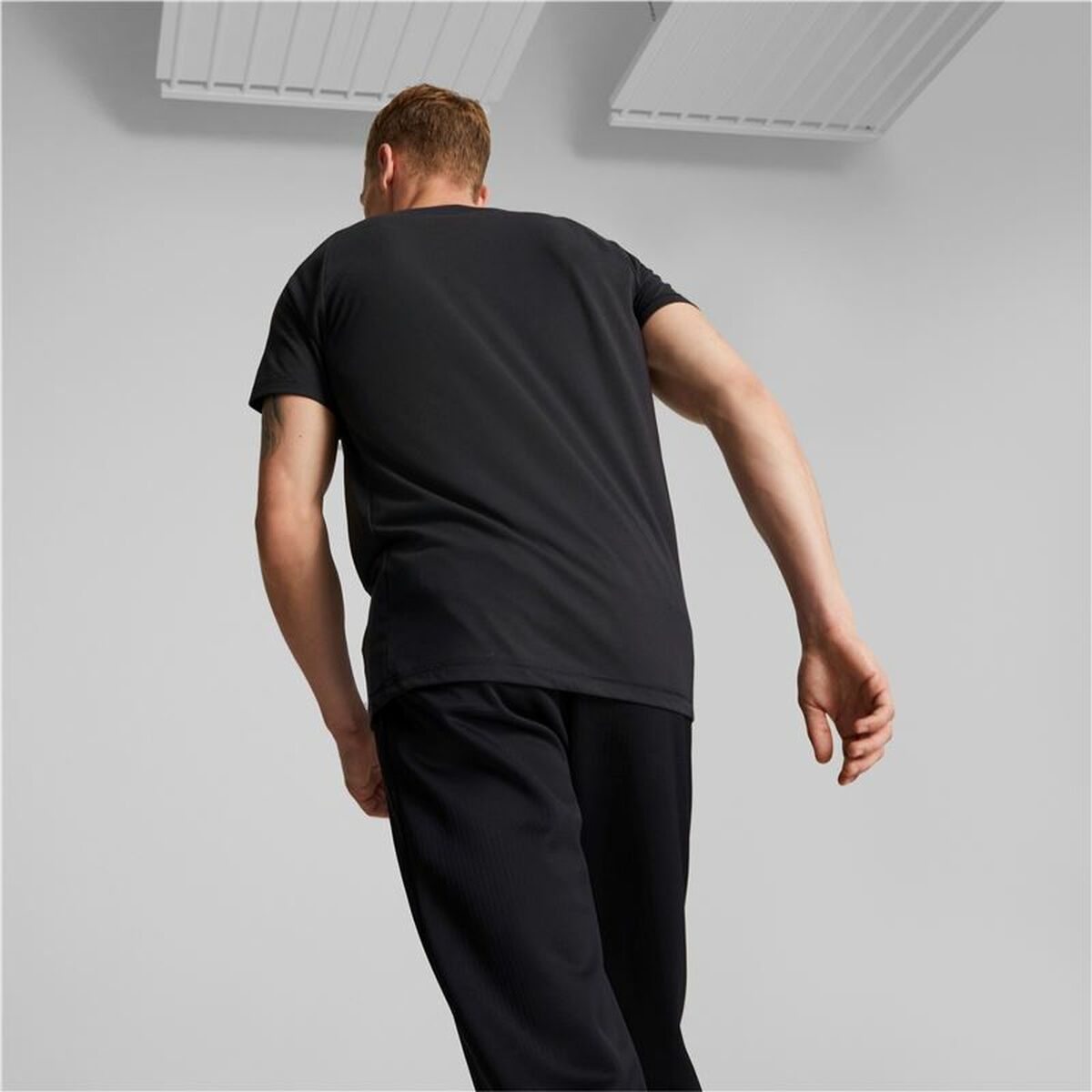 Heren-T-Shirt met Korte Mouwen Puma Evostripe Zwart Mannen
