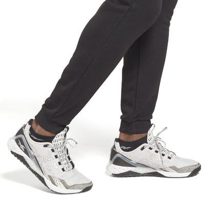 Broeken voor Volwassenen Reebok  LEFT LEG JOGG HS7376  Zwart Mannen